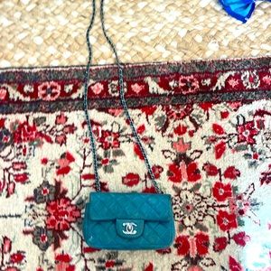 Chanel cross body small turquoise quilted leather bag w silver hardware/chain